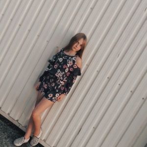 A purple long sleeve floral off the shoulder dress